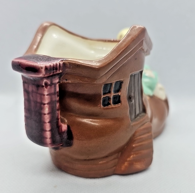 VINTAGE HAND PAINTED PORCELAIN SHOE HOUSE WITH CHILD FIGURINE/ PLANTER - JAPAN
