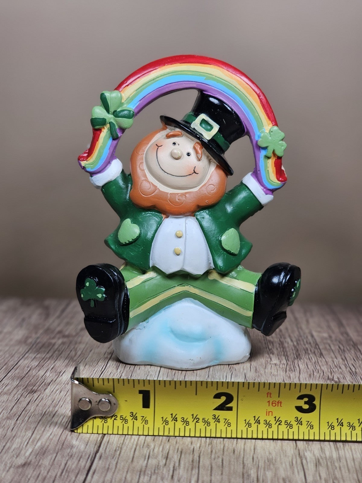 Saint Patricks Day Ceramic Leprechaun Holding Rainbow Figurine