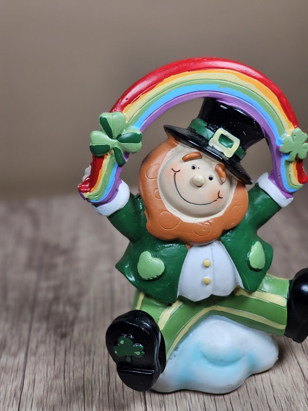 Saint Patricks Day Ceramic Leprechaun Holding Rainbow Figurine