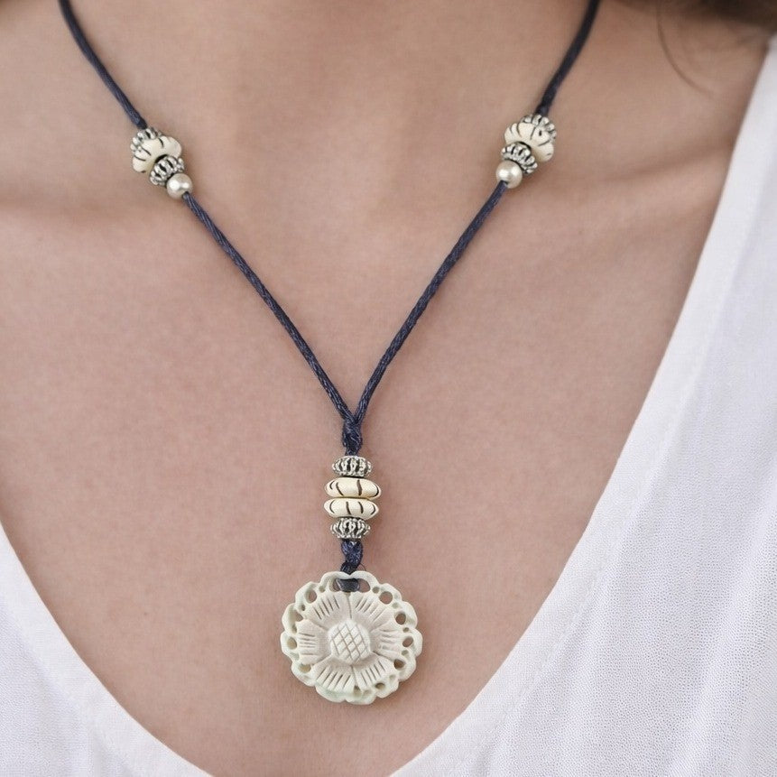 Vintage Carved Floral Pendant Necklace on Black Cord