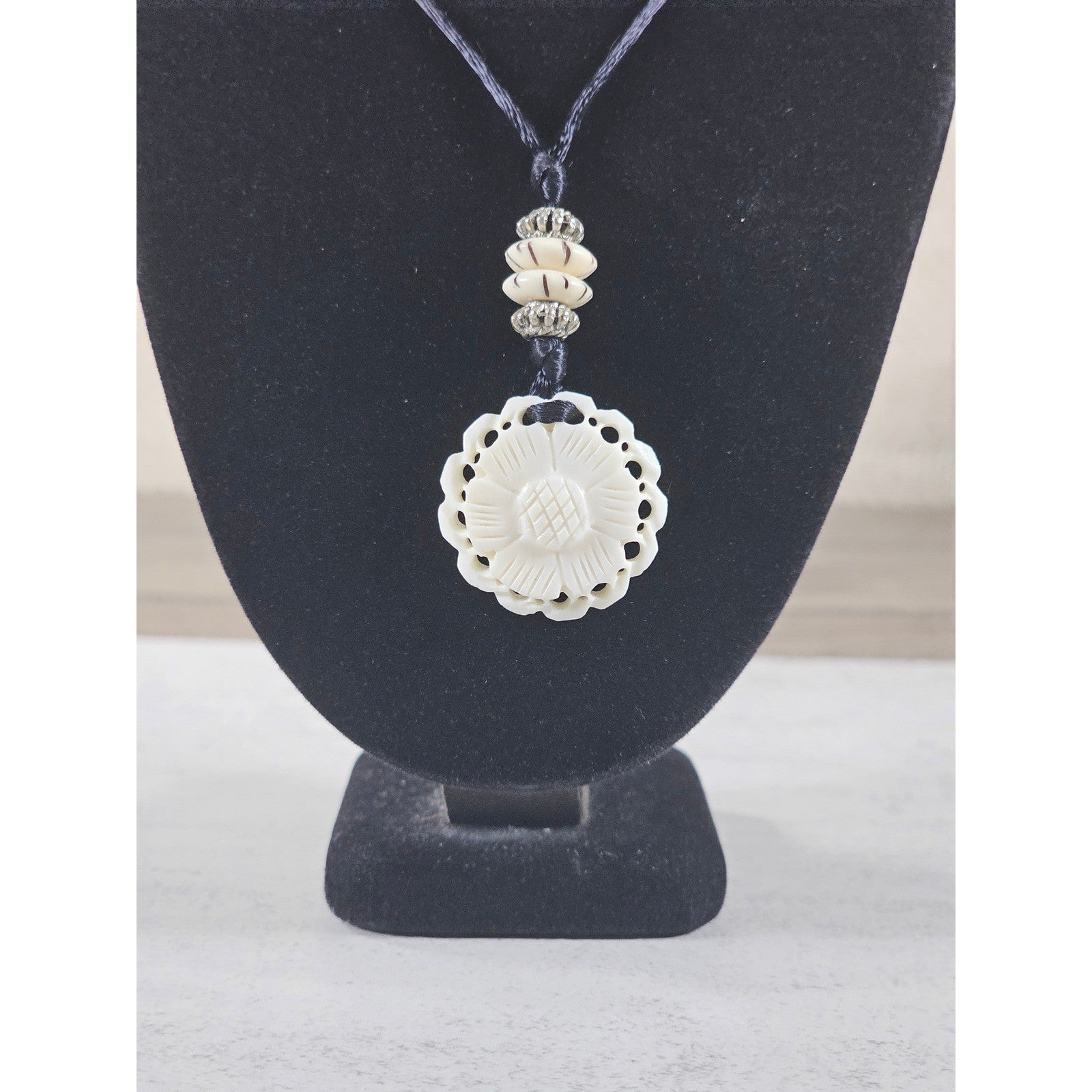 Vintage Carved Floral Pendant Necklace on Black Cord