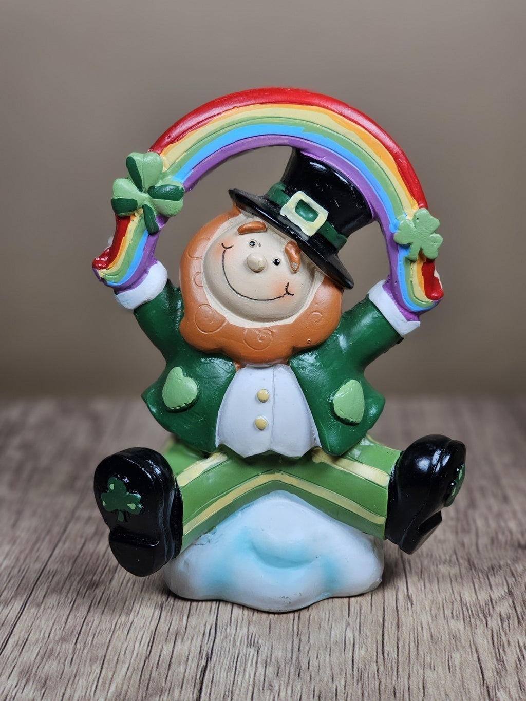 Saint Patricks Day Ceramic Leprechaun Holding Rainbow Figurine