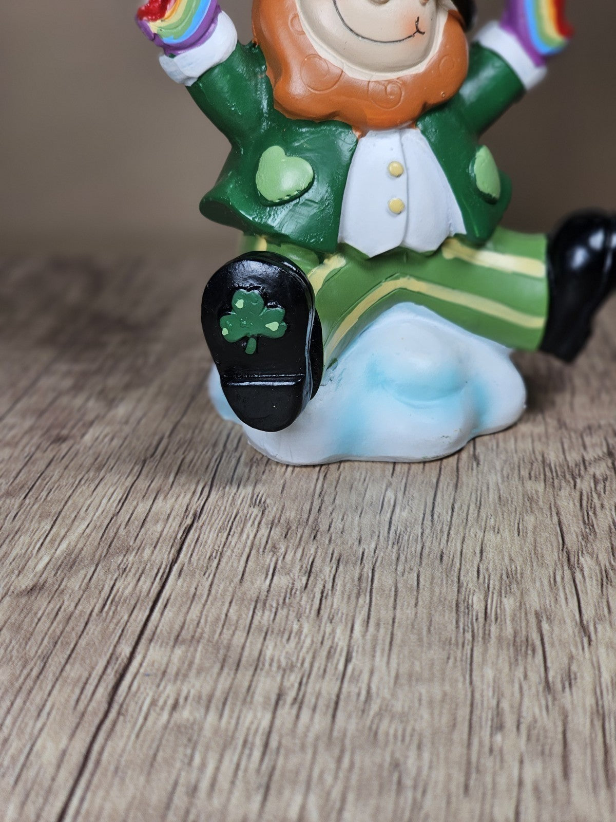 Saint Patricks Day Ceramic Leprechaun Holding Rainbow Figurine