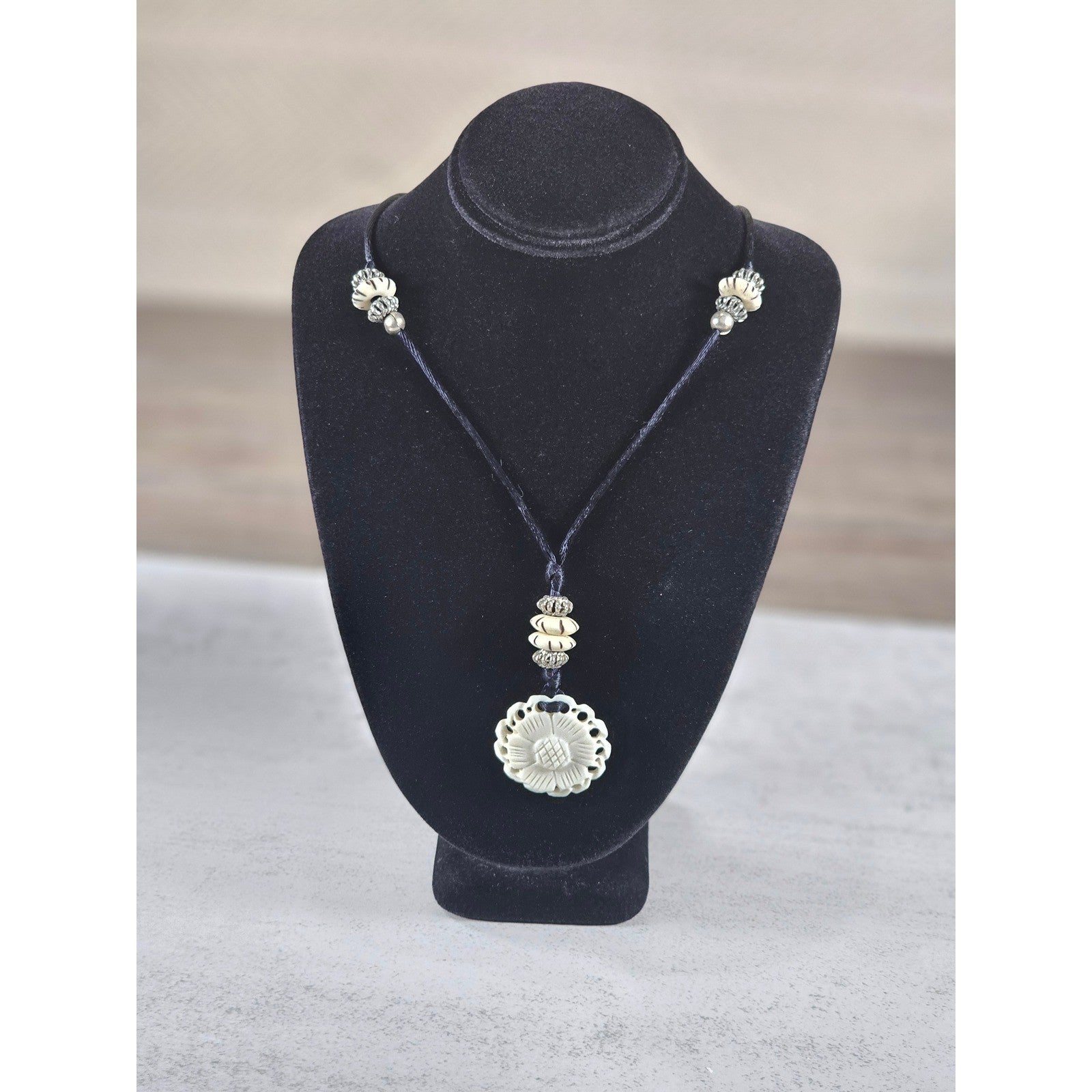 Vintage Carved Floral Pendant Necklace on Black Cord