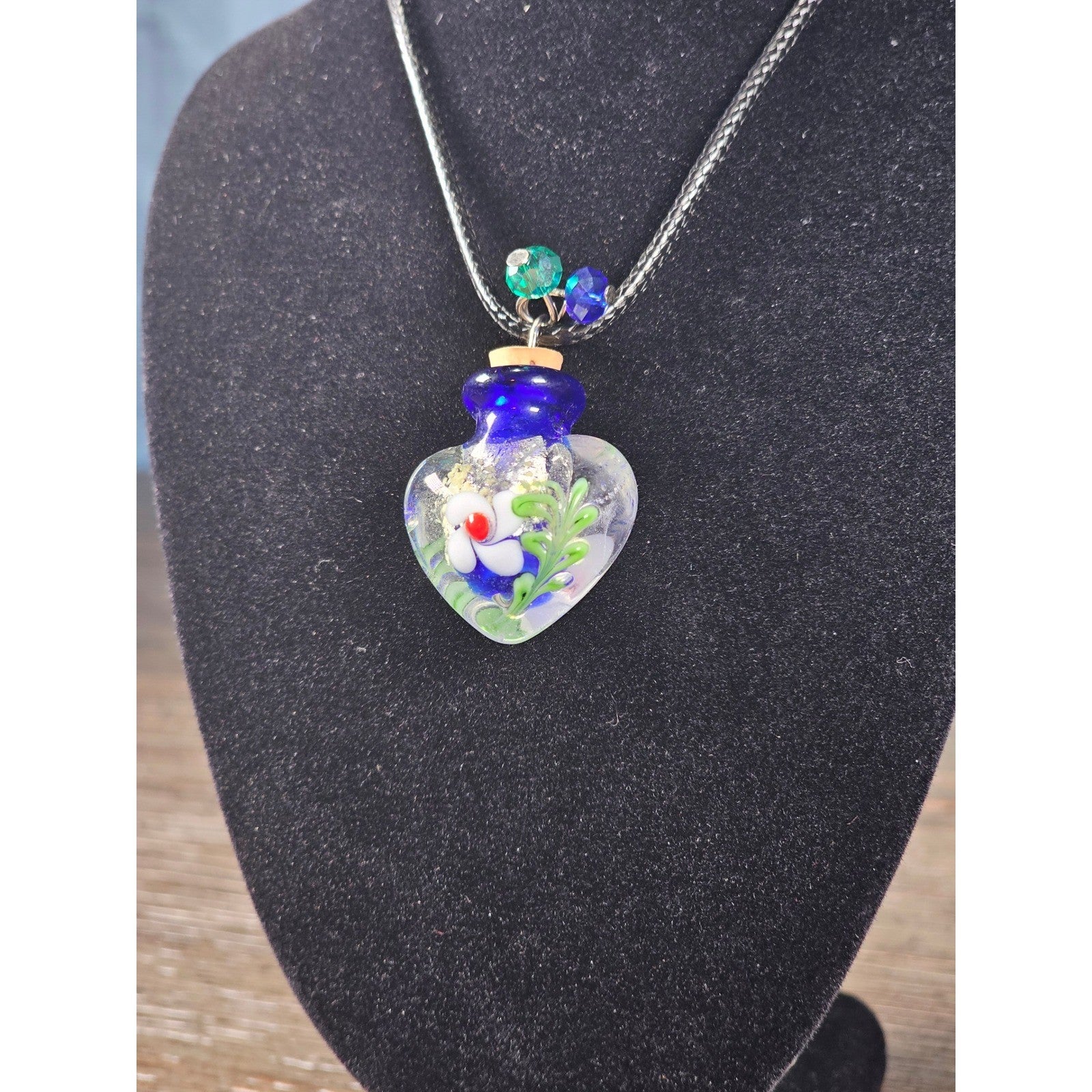 Glass Heart Bottle Pendant Necklace with Floral Design on Black Cord