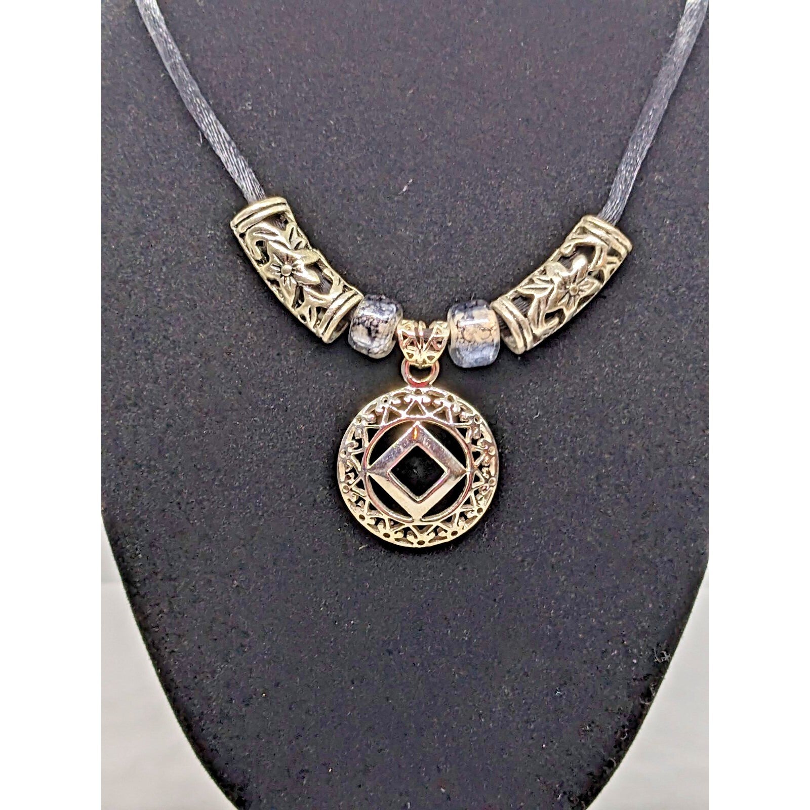 925 Sterling Silver NA Recovery Symbol Necklace on 16 Inch Cord