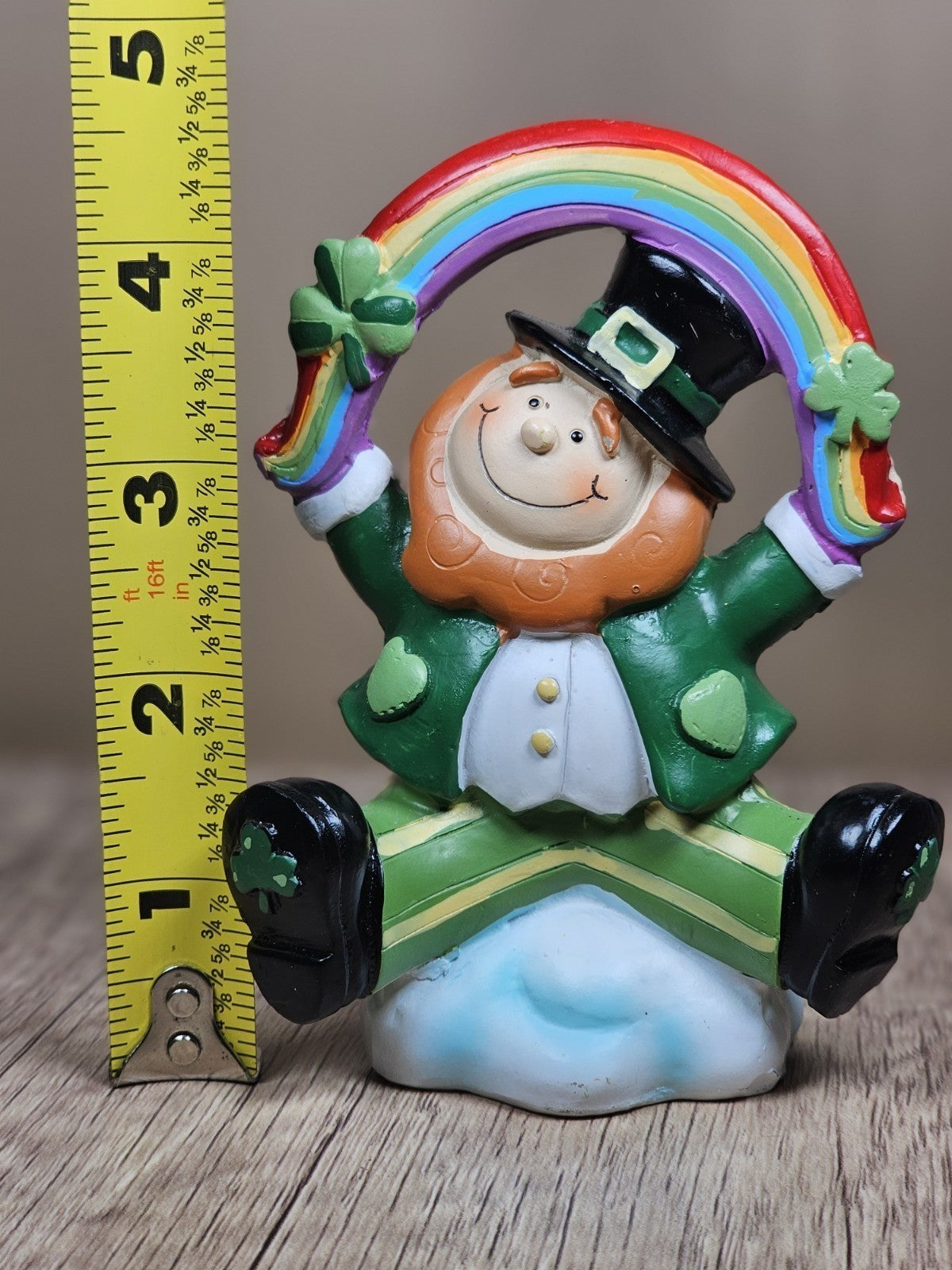 Saint Patricks Day Ceramic Leprechaun Holding Rainbow Figurine