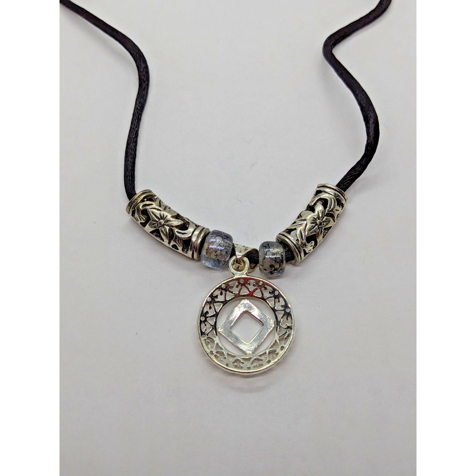 925 Sterling Silver NA Recovery Symbol Necklace on 16 Inch Cord
