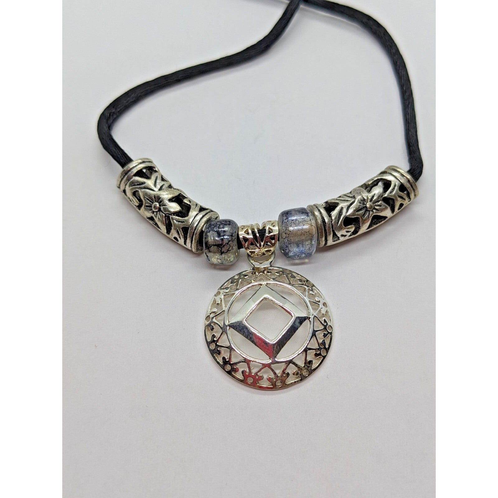 925 Sterling Silver NA Recovery Symbol Necklace on 16 Inch Cord