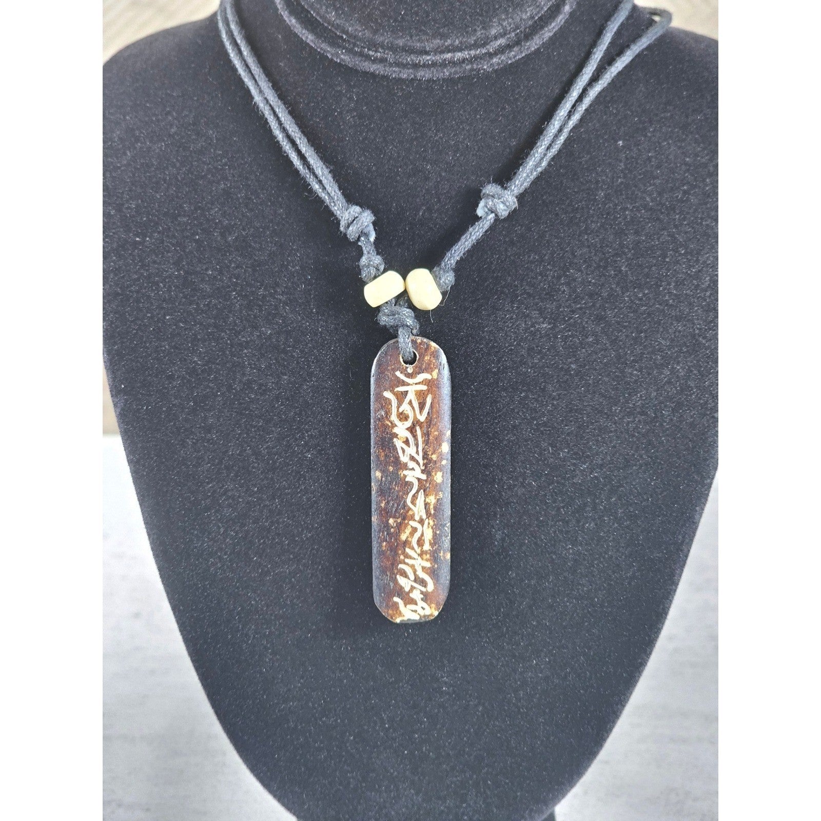 Vintage Carved Script Pendant Necklace Brown Cord